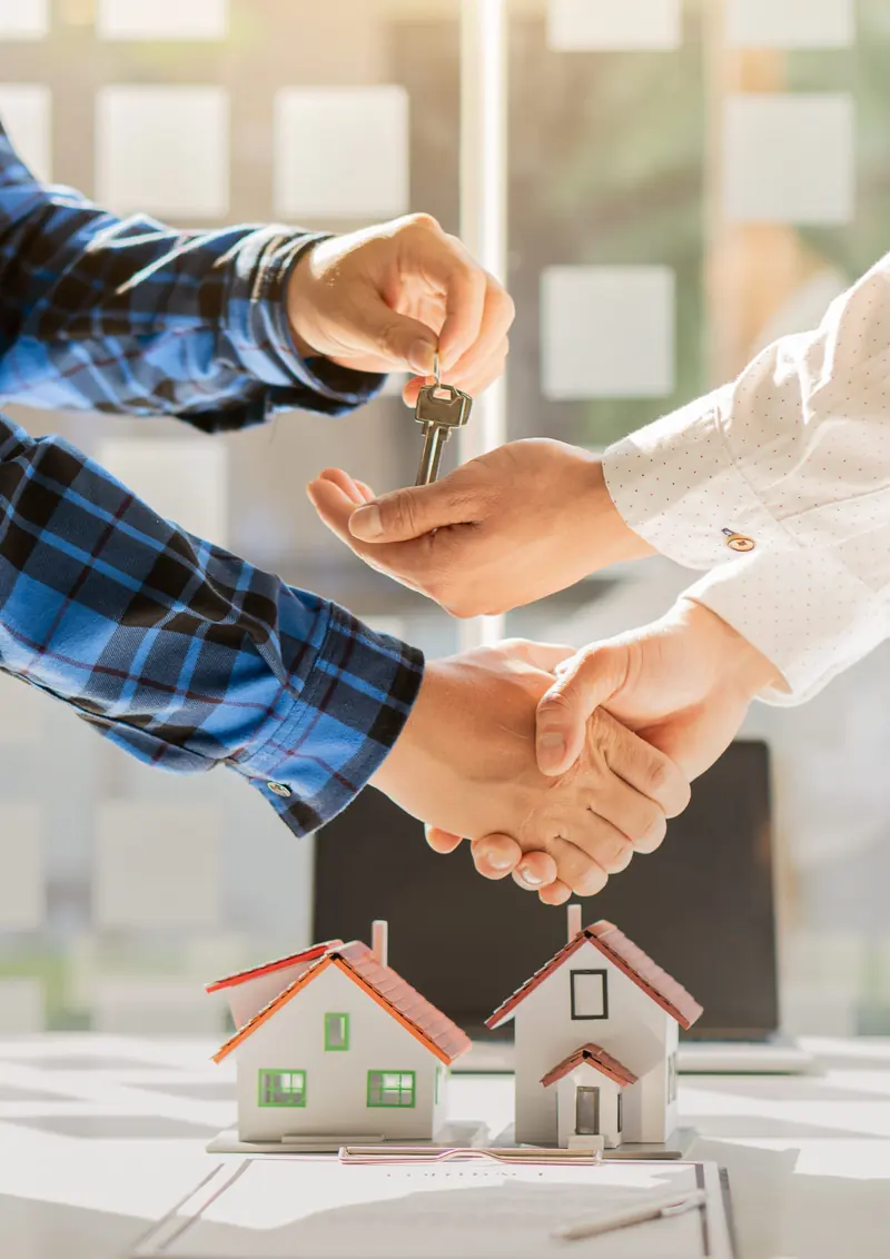 Business owner handing over keys to a client